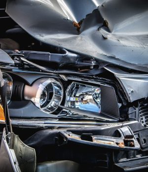 Close up of a car front bumper after an accident