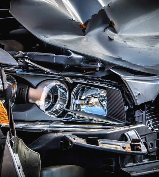 Close up of a car front bumper after an accident