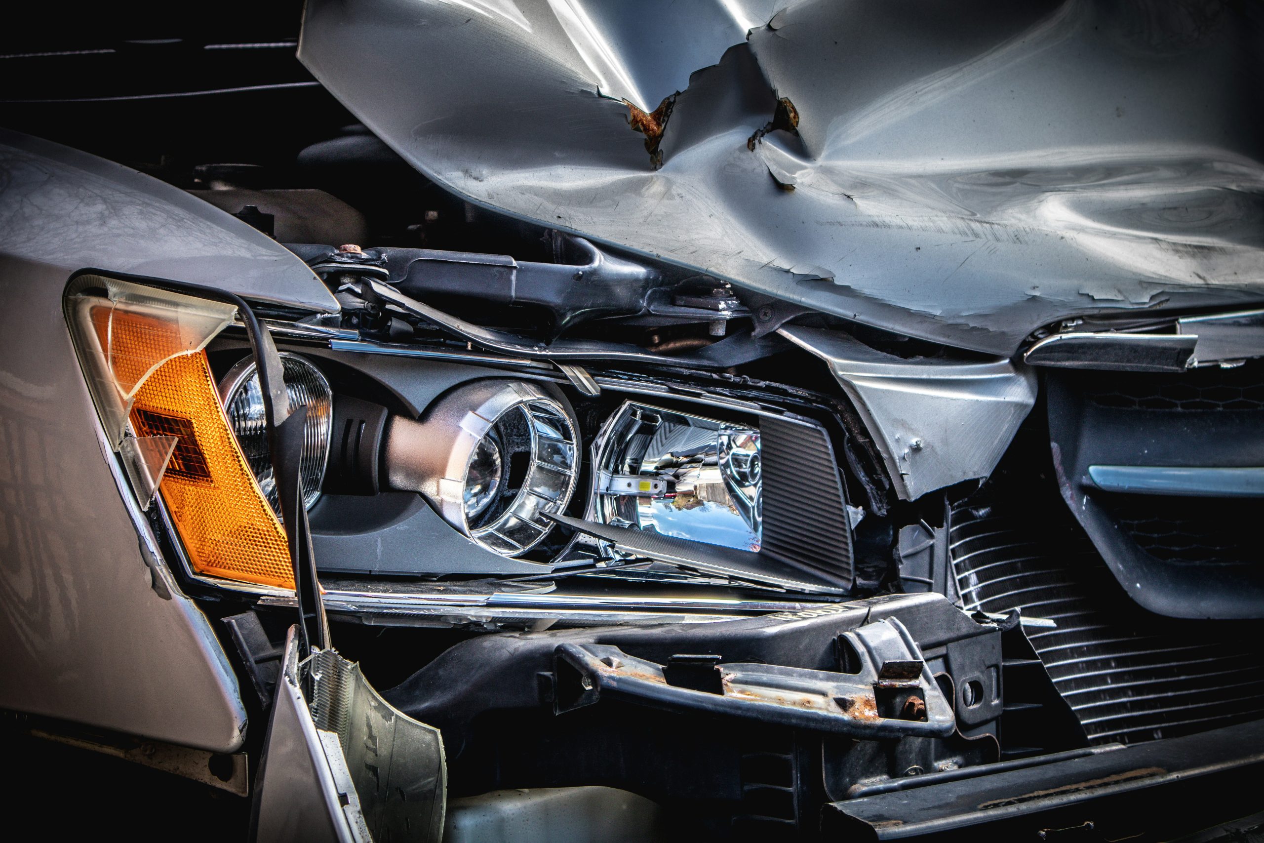 Close up of a car front bumper after an accident